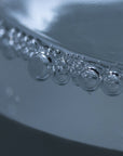Close-up van bubbels in onze magnesiumolie, zonder toevoegingen. Beste magnesium olie voor sporters. Te bestellen in onze webshop.