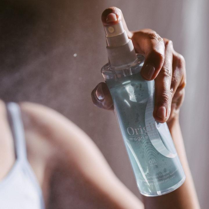 Woman spraying origin magnesium in the air