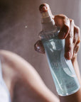Woman spraying origin magnesium in the air