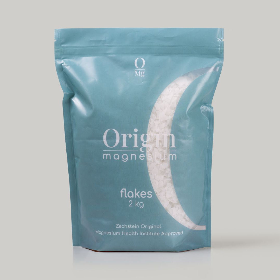 Origin OMG Magnesium Flakes, 2 kg package pack shot on a white background in a blue pouch