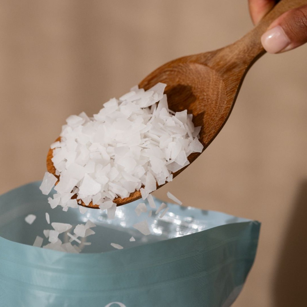 Magnesium flakes falling in a bag from a wooden spoon